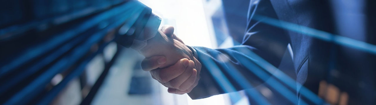 Handshake with blue light streaks